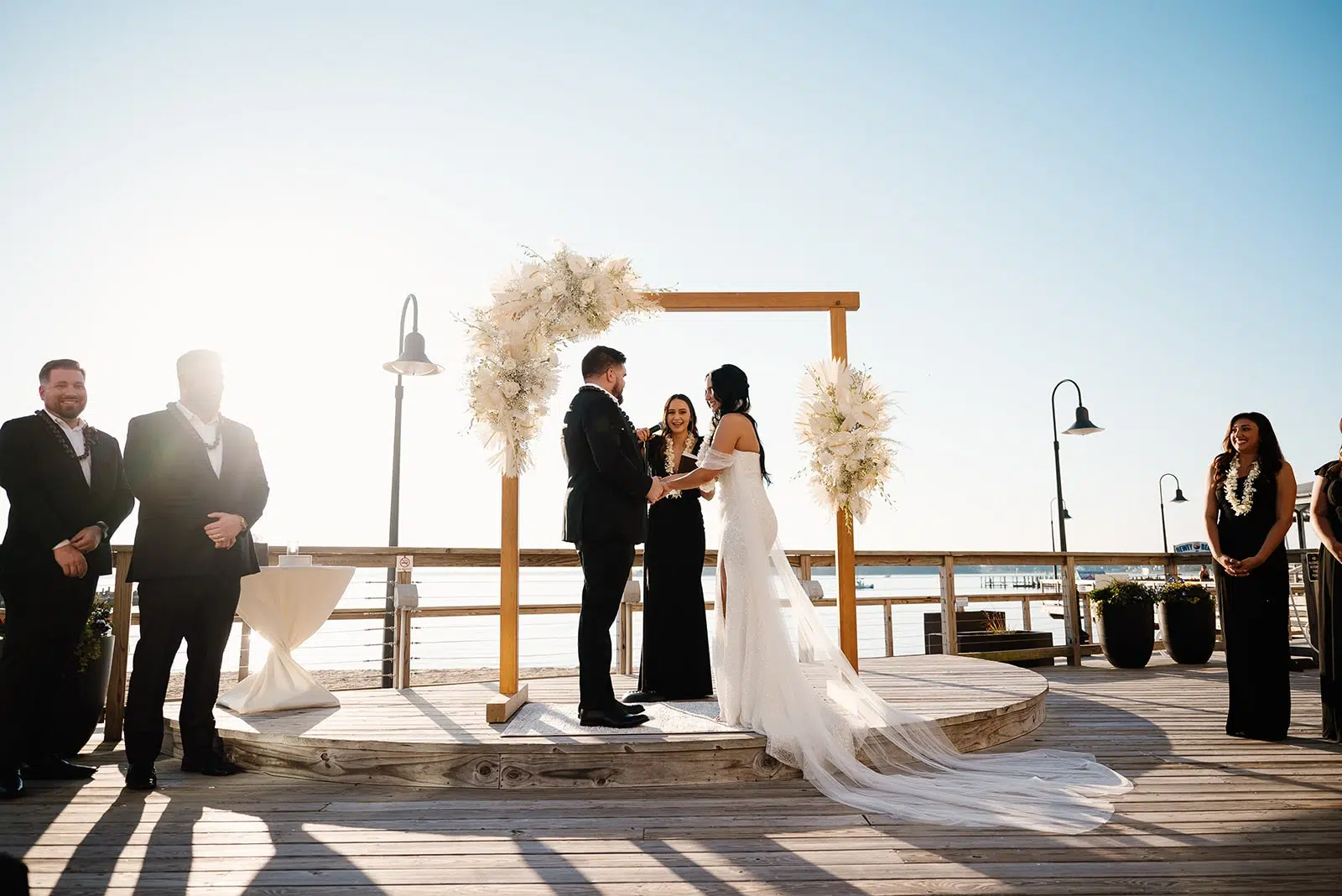 Photo of a couple at their wedding ceremony at a beachfront for outdoor wedding venues.