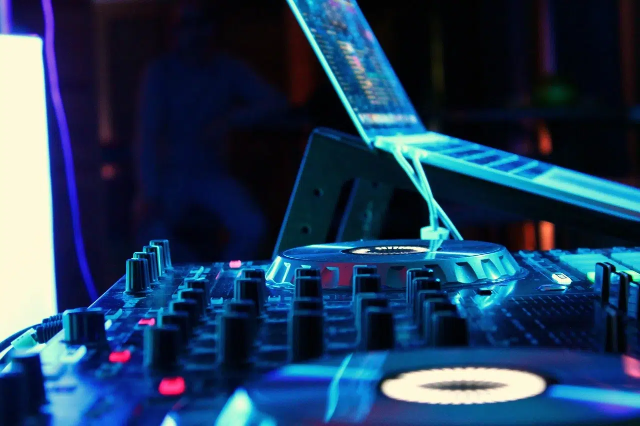 Photo of a DJ setup with a laptop for virtual event ideas.