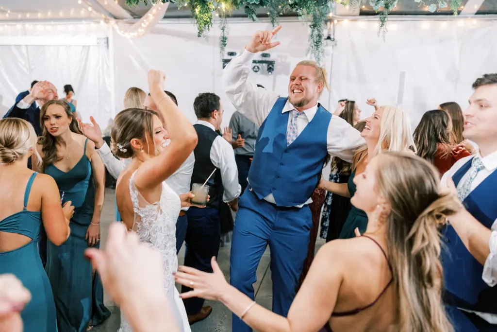 photo-of-a-bride-and-groom-dancing-with-their-guests-at-a-wedding (1)