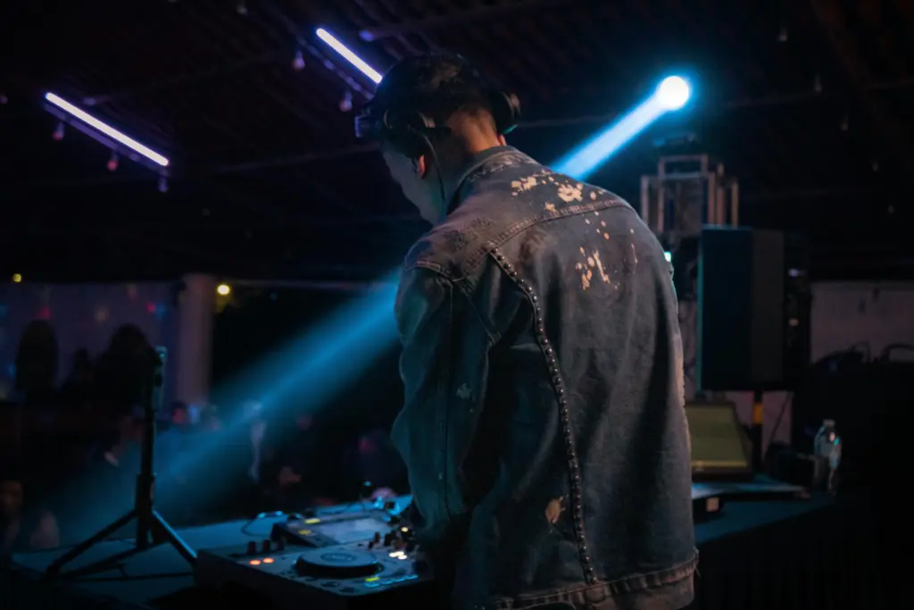 photo-of-a-man-working-the-dj-at-an-event
