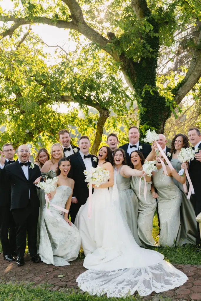 photo of a bride and groom with their bridesmaids and groomsmen in the woods for forest wedding venues maryland