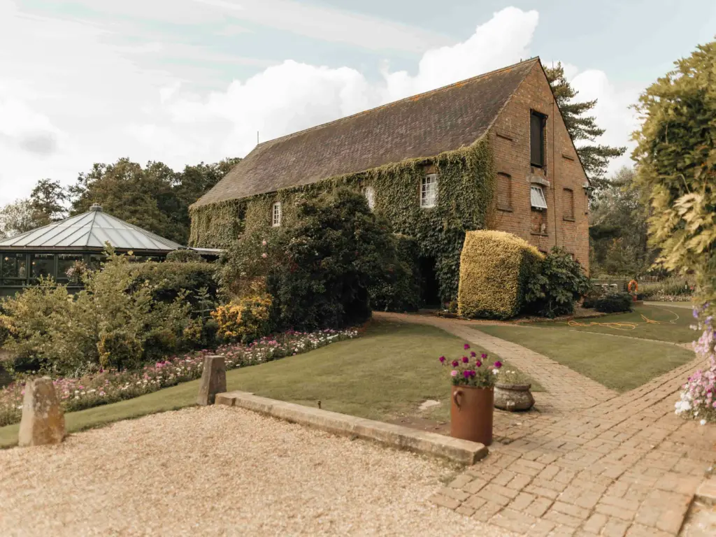photo of a historical house surrounded by bushes and trees for forest wedding venues maryland