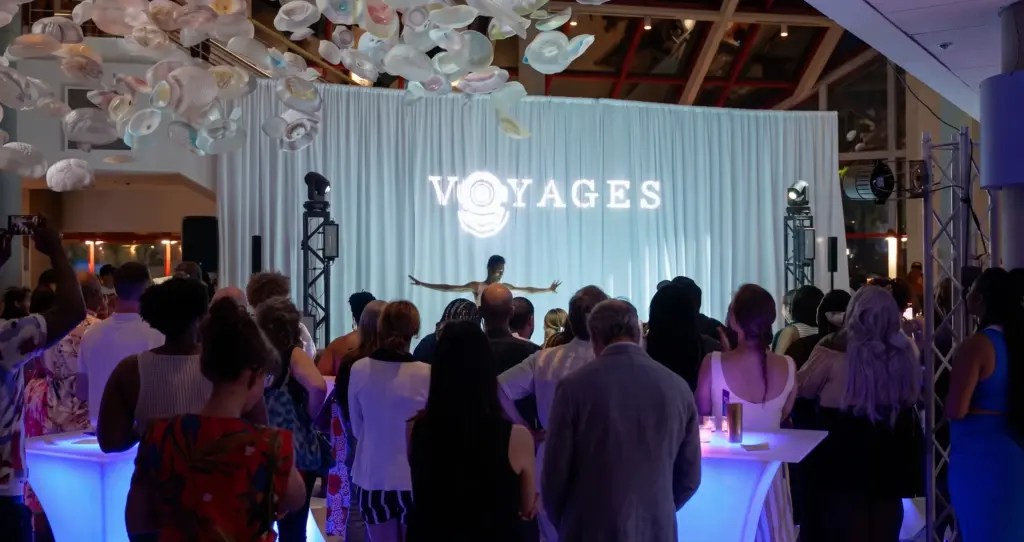 Photo-audience-watching-live-stage-performance-at-corporate-event-venue