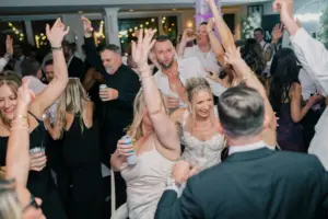 photo-of-a-bride-dancing-with-her-guests-at-the-wedding-for-how-much-does-a-wedding-videographer-cost