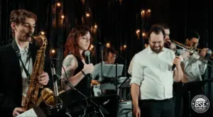 Photo of a live band performing at an event on stage by Baltimore Sound Entertainment.