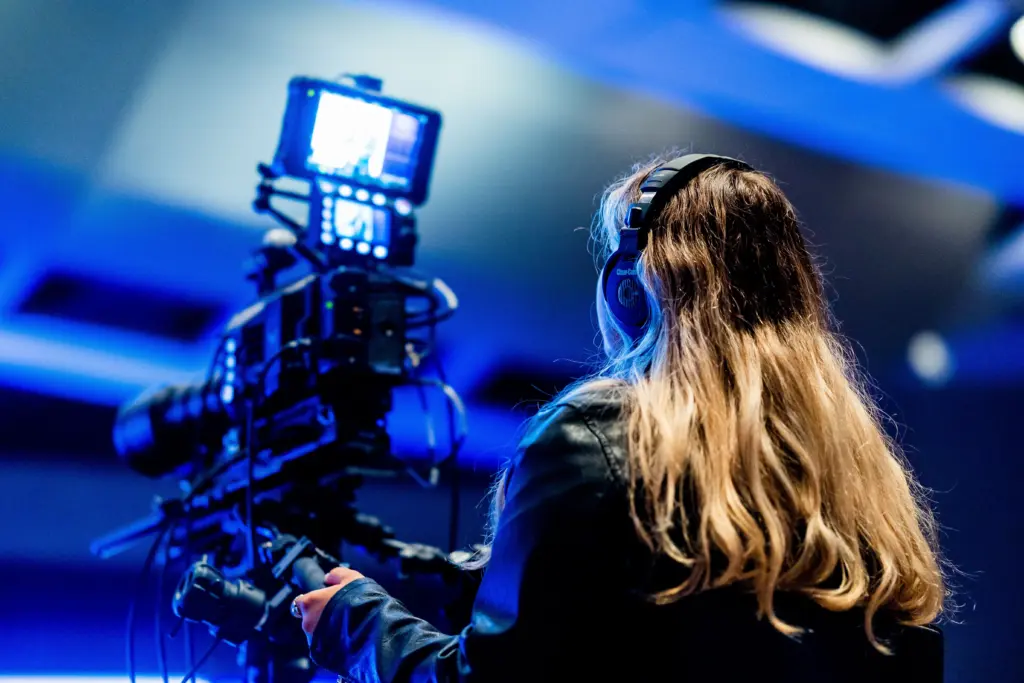 photo-of-a-videographer-filming-an-event-with-her-camera