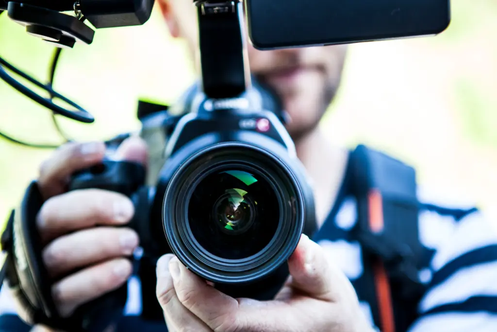 photo-of-a-videographer-holding-up-his-camera-for-how-much-does-a-wedding-videographer-cost