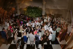 photo of guests at a wedding dancing on the dance floor with glowsticks for dj york pa