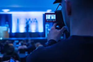 photo of a videographer filming a corporate event