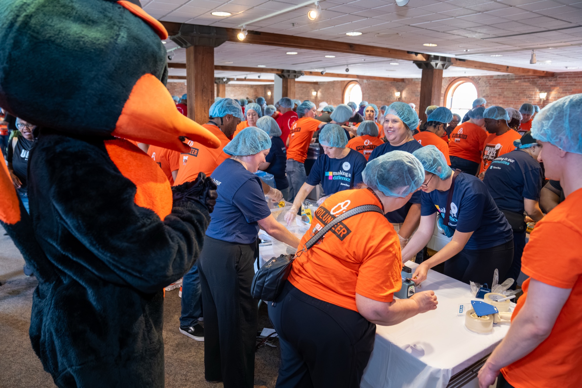 The Oriole Bird joins volunteers packing meals