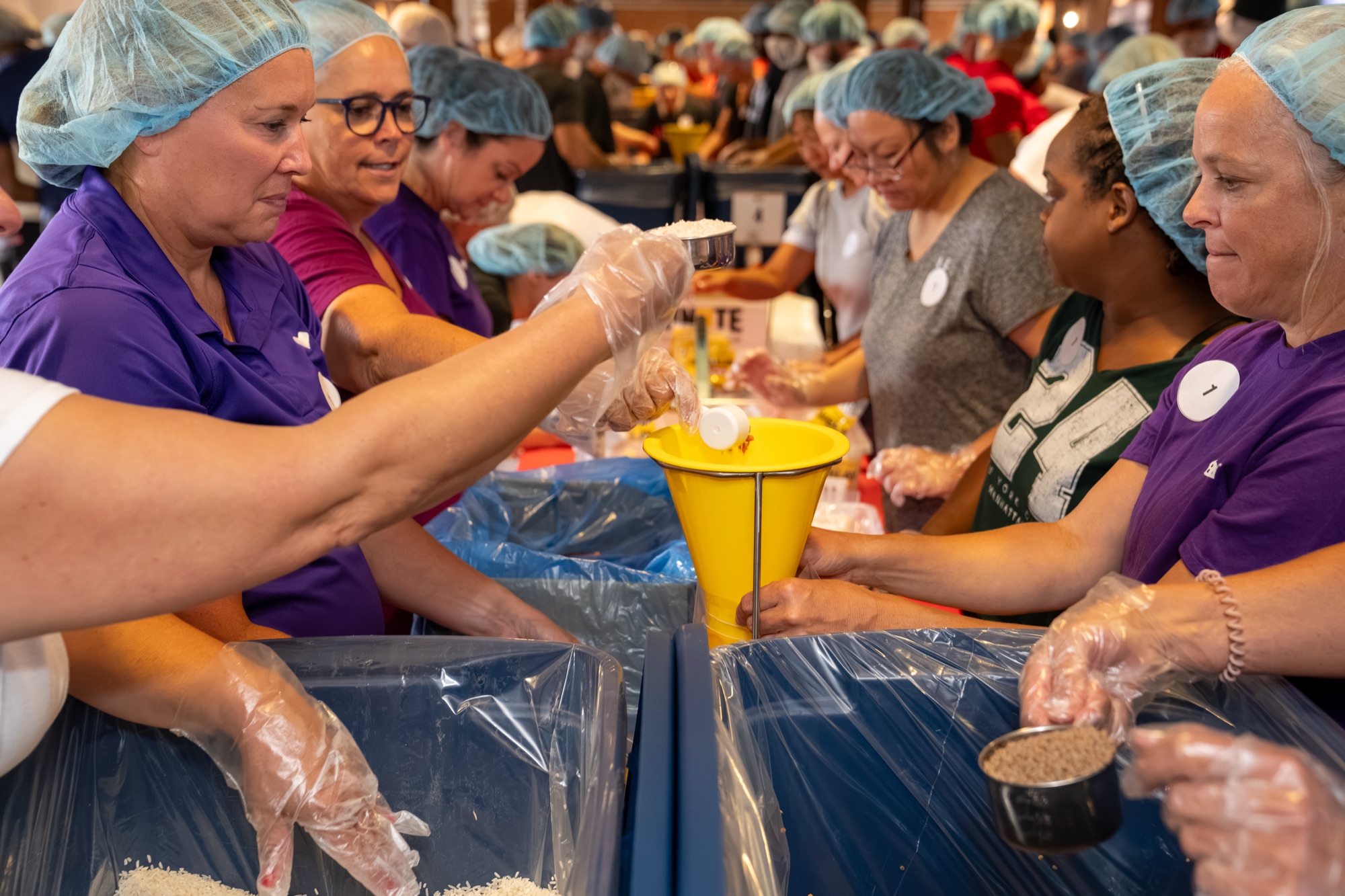 Volunteers on the meal packing line