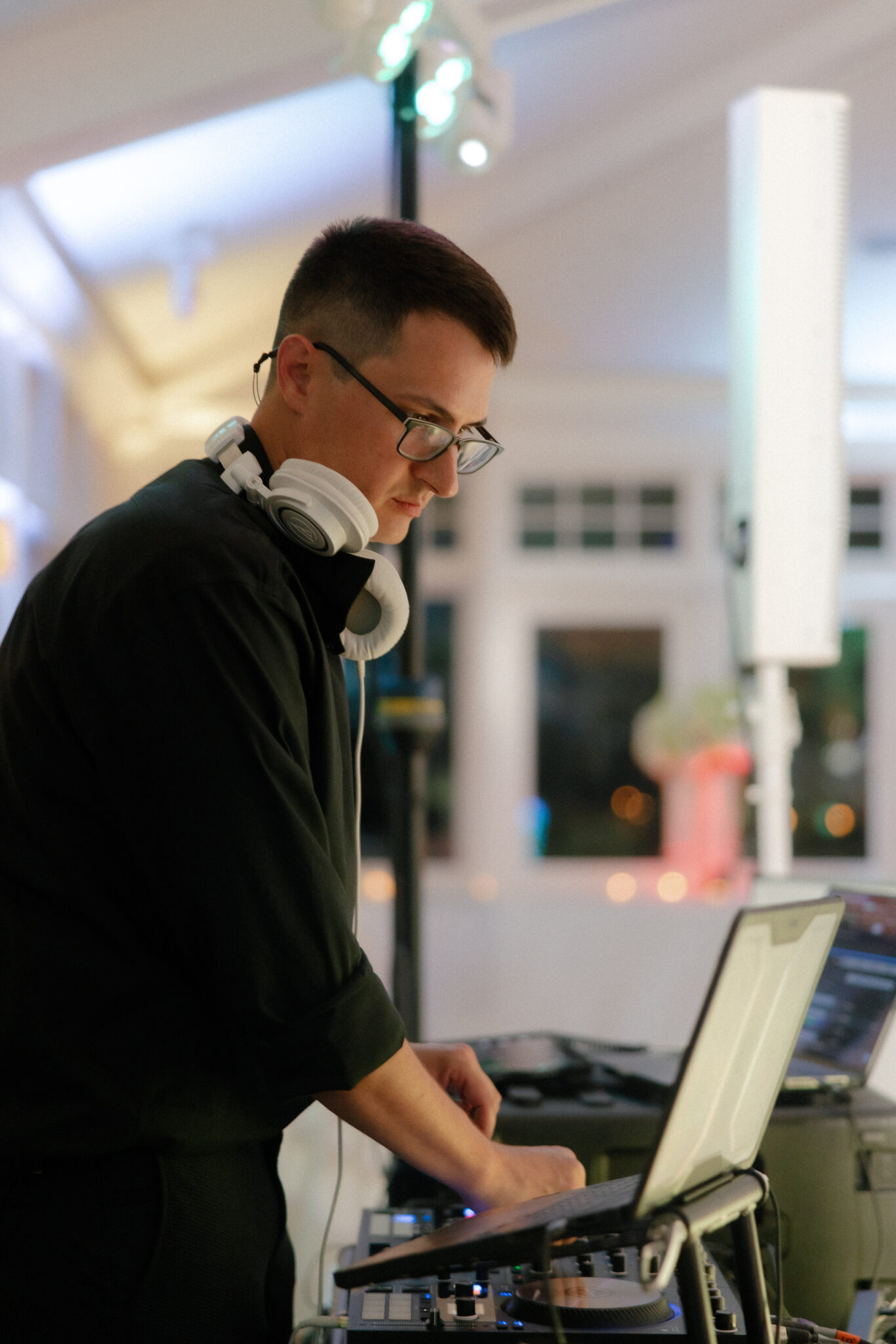 DJ Jeff Lang mixing at the decks during a wedding reception