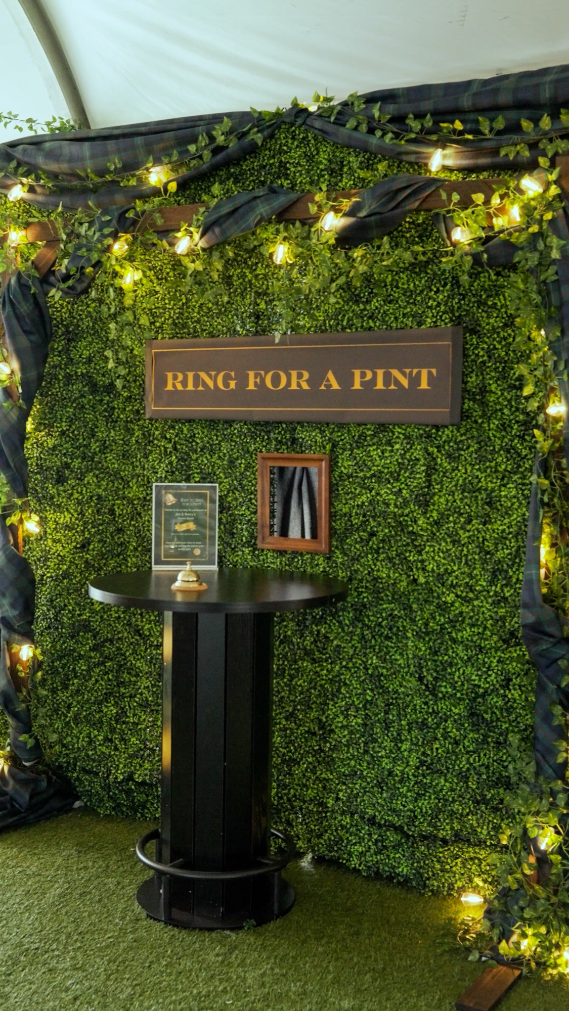 Guest at the Ring for a Pint wall inside the Guinness tent