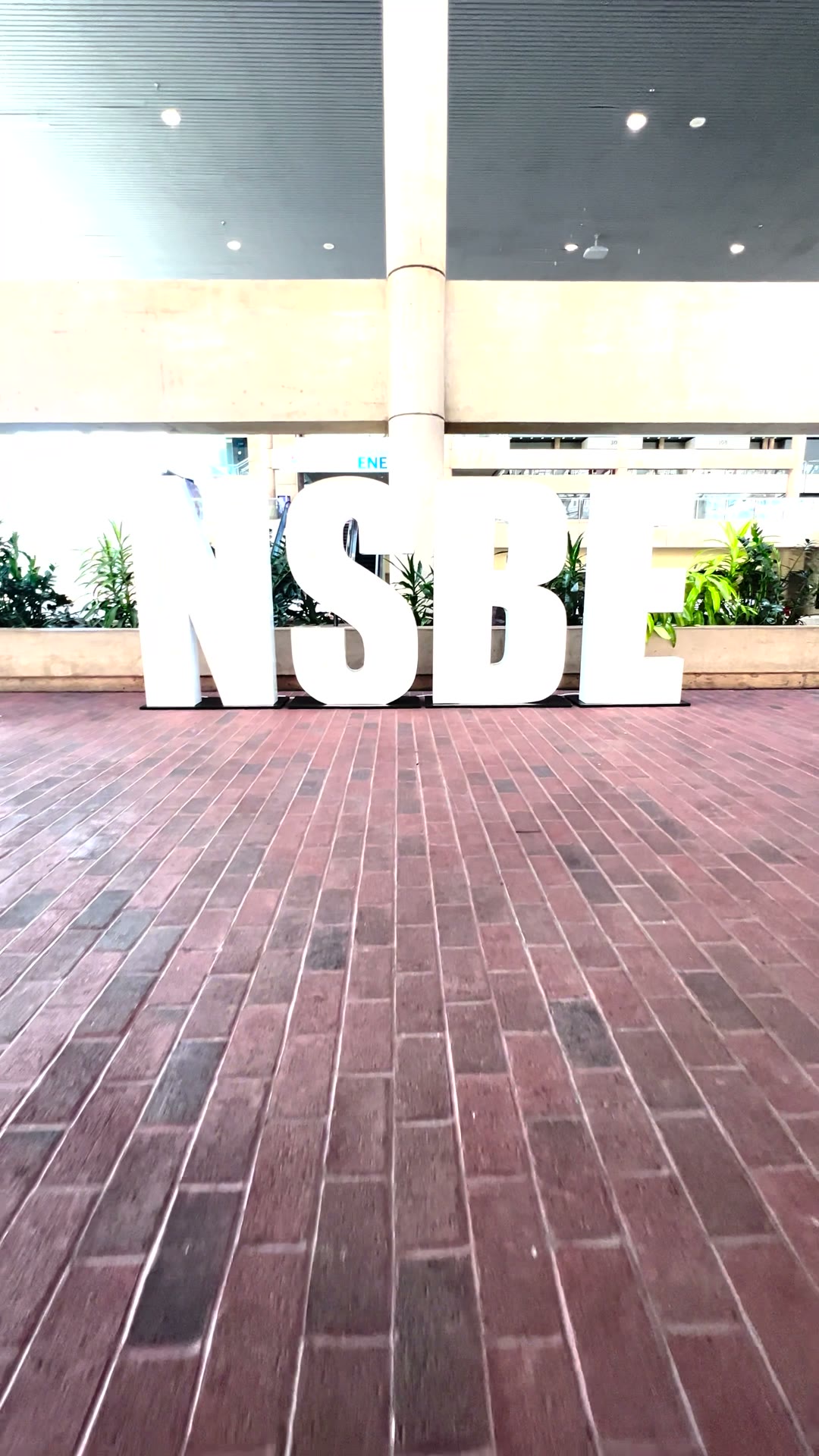 Giant white NSBE marquee letters standing on the brick plaza at the Baltimore Convention Center