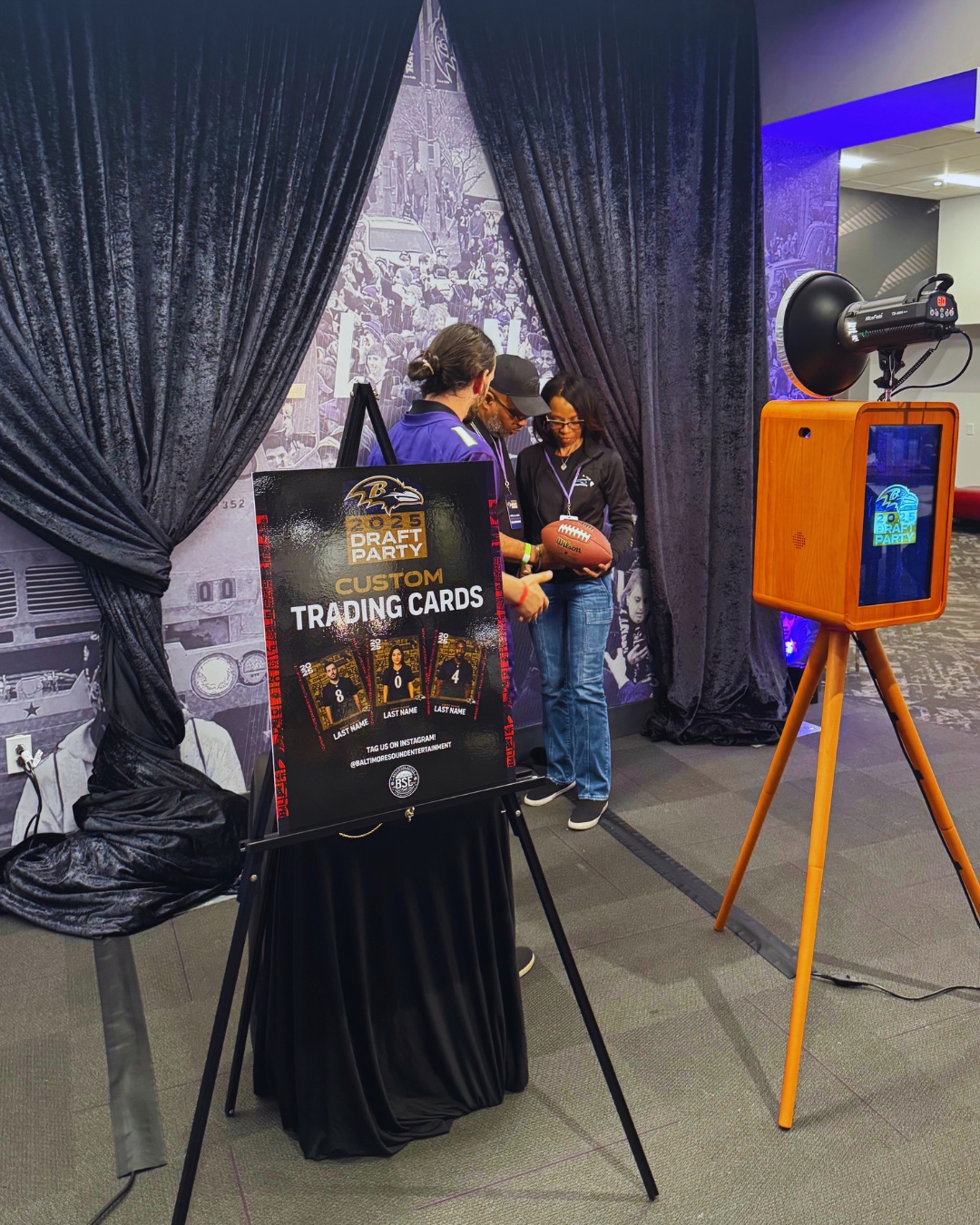 Ravens Draft Party trading card station with booth and signage