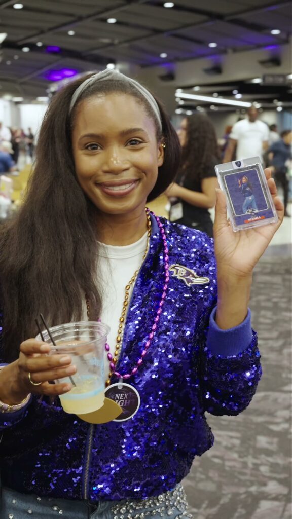 Ravens fan smiling with her custom trading card