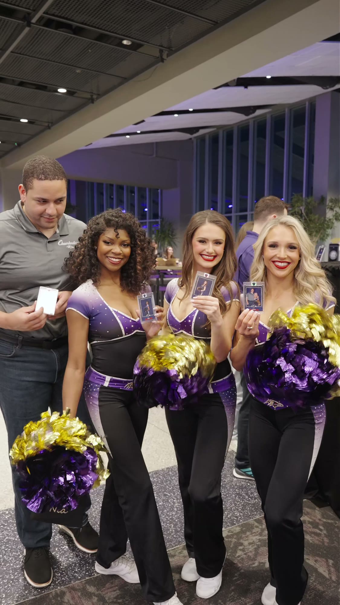 Ravens cheerleaders with guests at the Draft Party