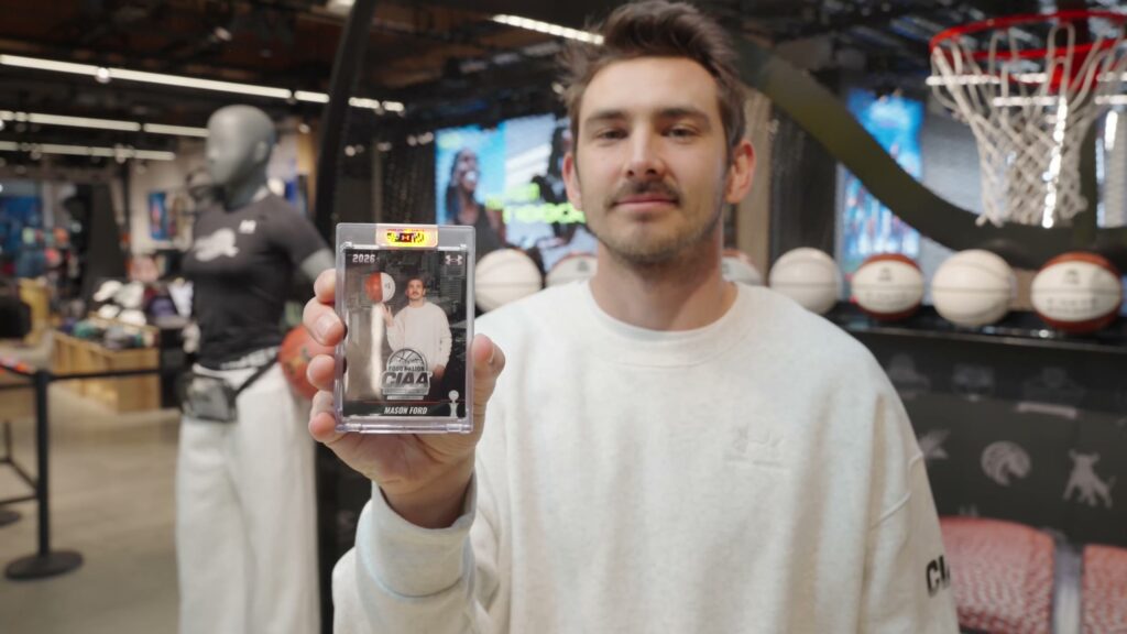 Under Armour team member holding a finished CIAA player card
